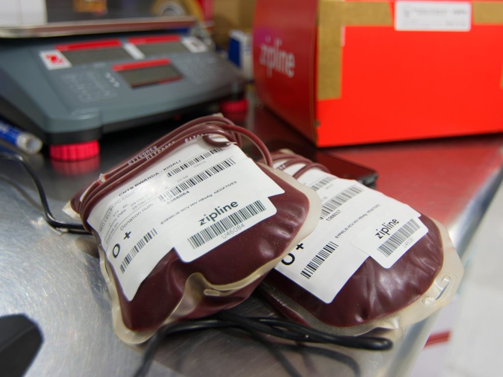 A technician packs the blood into a padded cardboard box with a parachute attached. Photo: Evan Ackerman